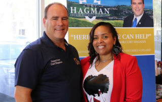 Caramel Connections Founder Elizabeth McSwain and San Bernardino 4th District Supervisor Curt Hagman pose for a photo as Elizabeth is honored as "Community Hero"